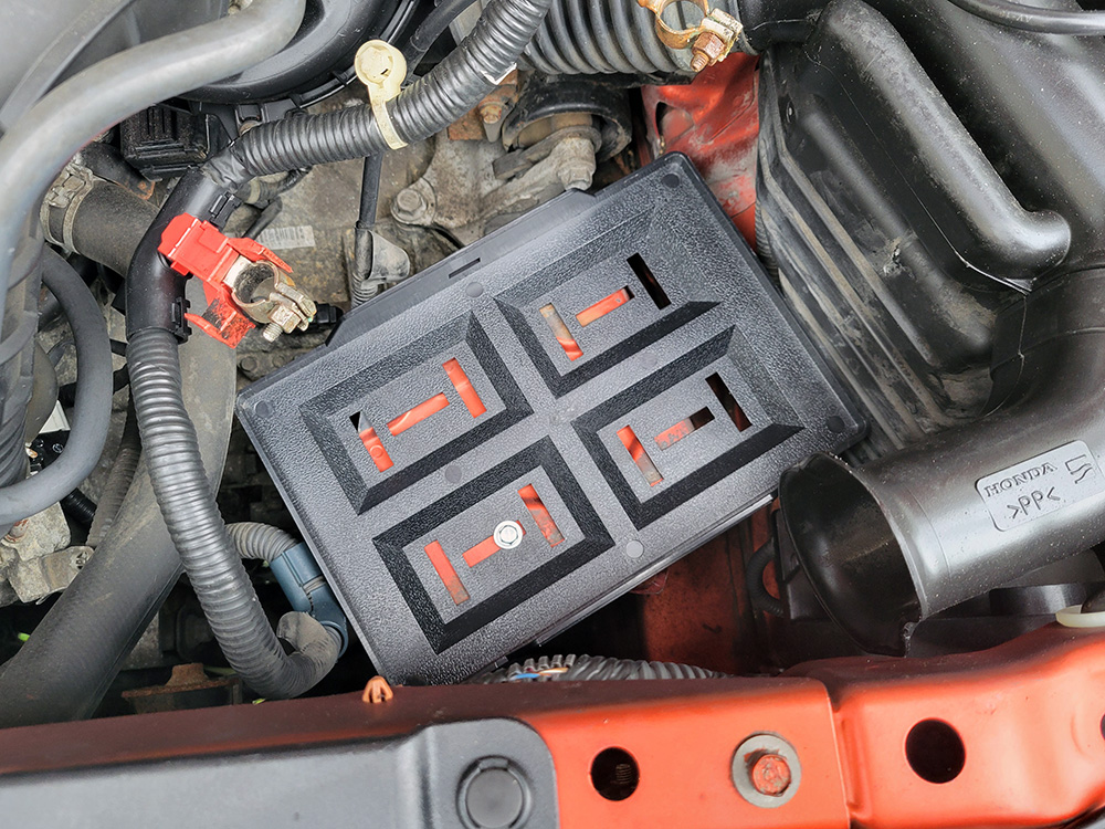 The new battery tray and single bolt