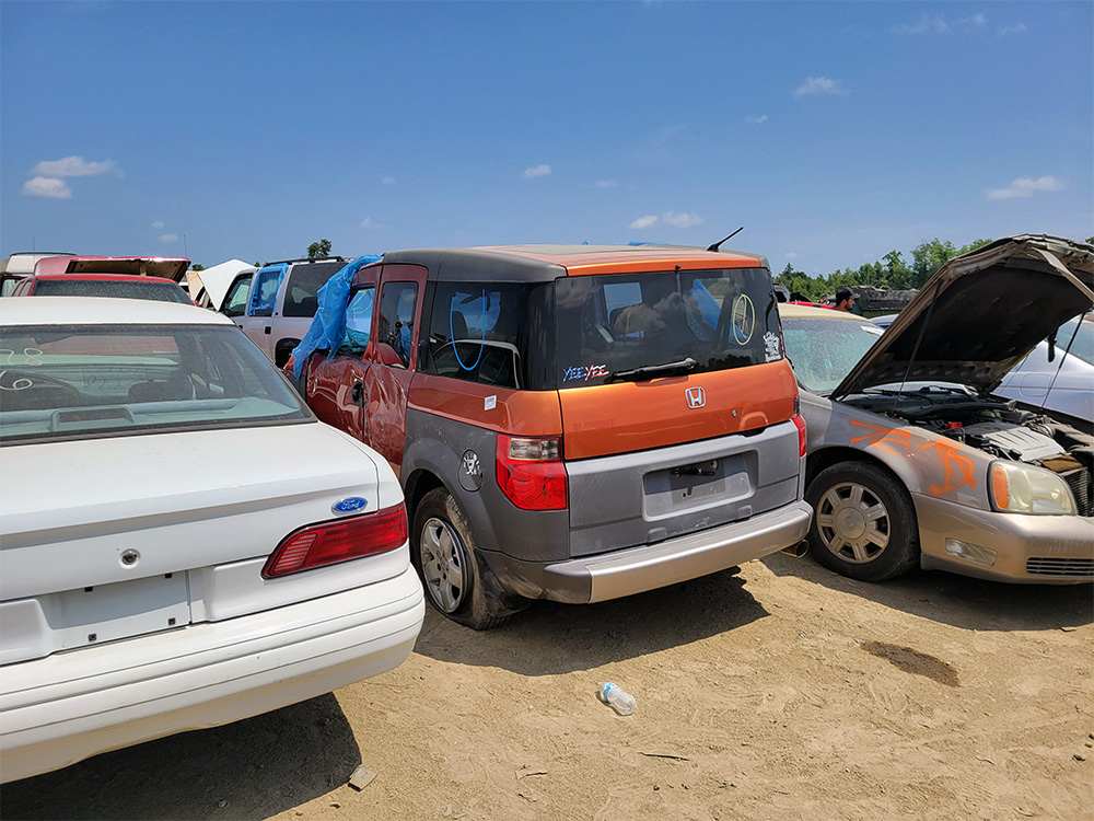 A Sunset Orange E at the junkyard